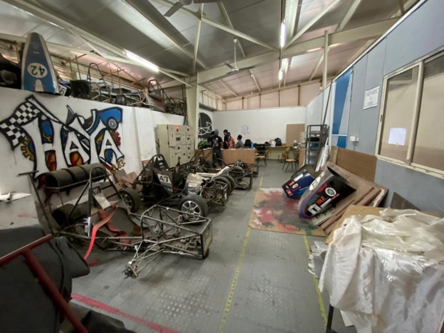 Team Haya workshop with multiple generations of cars