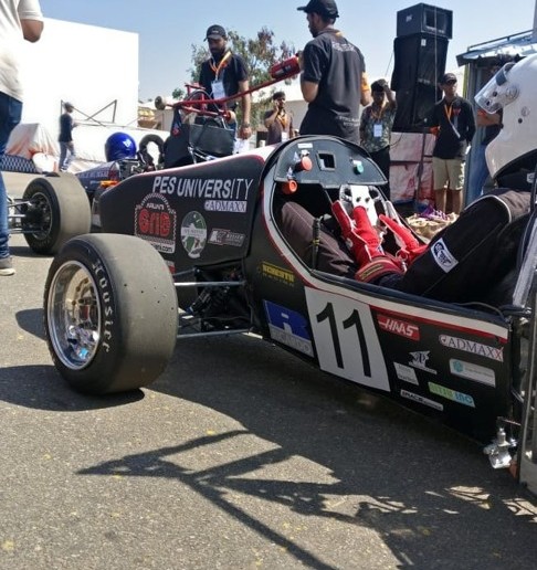 Team Haya Racing Formula Student car #11 with carbon fiber bodywork at competition