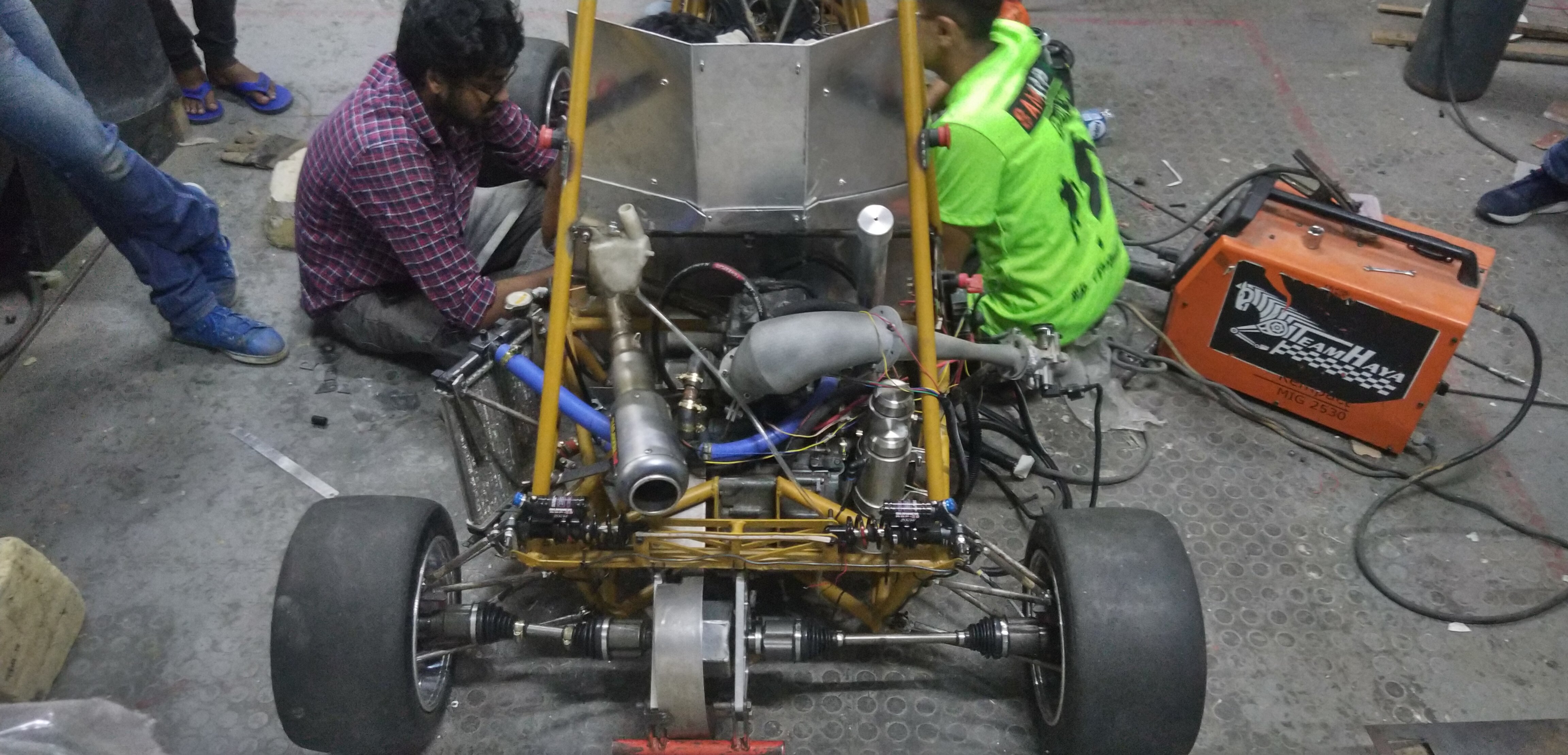 Rear suspension and powertrain assembly in the Team Haya workshop